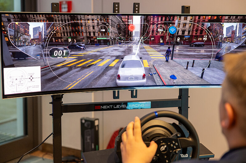 A man is playing a video game on a monitor.