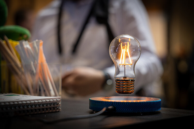 A floating light bulb in the room, emitting light.