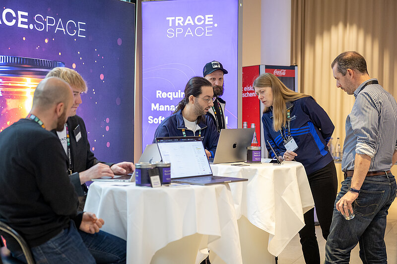 Trace Space stand at CES 2018, featuring futuristic technologies and visitors exploring the innovations.